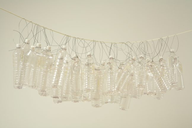 <p>Tony Feher (U.S., 1956-2016). <em>Untitled (No Clouds)</em>, 2000. Assemblage (clear plastic bottles and white caps, water, wire, and nylon cord). Henry Art Gallery, gift from the collection of Rebecca and Alexander Stewart, 2001.2.1-41. [Installation view, <em>Vortexhibition Polyphonica</em>, 2009-2011, Henry Art Gallery, University of Washington, Seattle] </p>
