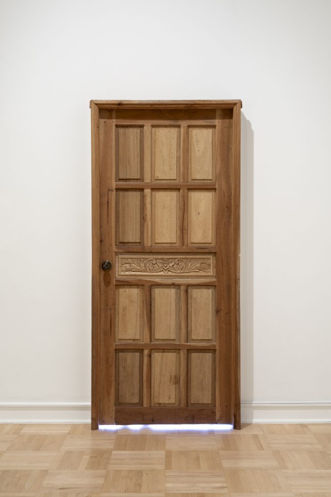 <p>James Clar (U.S., b. 1979). Nobody’s Home (Manila). 2020. Wooden door, LED lights, microcontroller. Courtesy of the artist and Silverlens, Manila and New York. [Installation view, <em>Spirit House,</em> Henry Art Gallery, University of Washington, Seattle. 2025]. Photo: Jueqian Fang. </p>
