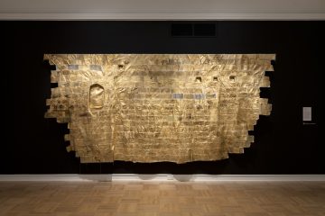 <p>Namita Paul (U.S., b. 1970). <em>Testimony</em>. 2023. Canvas, thread, gold leaf, paint, lentils, wheat berries, assorted textiles, photo transfer. Courtesy of the artist. [Installation view, <em>Spirit House</em>, Henry Art Gallery, University of Washington, Seattle. 2025]. Photo: Jueqian Fang. </p>
