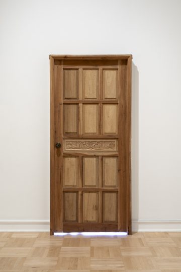 <p>James Clar (U.S., b. 1979). Nobody’s Home (Manila). 2020. Wooden door, LED lights, microcontroller. Courtesy of the artist and Silverlens, Manila and New York. [Installation view, <em>Spirit House,</em> Henry Art Gallery, University of Washington, Seattle. 2025]. Photo: Jueqian Fang. </p>
